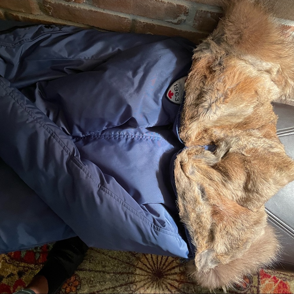 Pajar coat. Very warm & snuggly. No need for a sweater or hat.